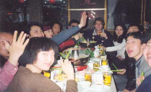 Young Chinese artists having diner